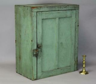 A 19th C Hanging Or Table Cupboard In Apple Green Paint Panel Door