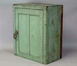 A 19TH C HANGING OR TABLE CUPBOARD IN APPLE GREEN PAINT PANEL DOOR 6