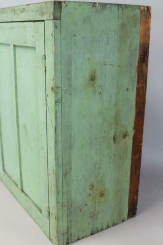 A 19TH C HANGING OR TABLE CUPBOARD IN APPLE GREEN PAINT PANEL DOOR 7