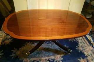Signed Stickley Cherry Banded Top And Carved Base Coffee Table.