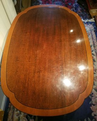 Signed Stickley Cherry Banded Top And Carved Base Coffee table. 2