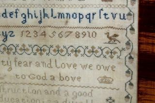 A RARE SIGNED & DATED 1814 NEEDLEWORK SAMPLER 