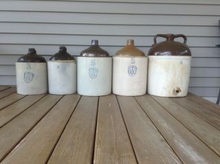 Two 5 Gallon Wine Jugs And Two 3 Gallon Jugs,  And One 8 Gallon Jug.  Uhl Pottery.
