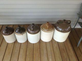 Two 5 Gallon wine jugs and two 3 gallon jugs,  and one 8 gallon jug.  Uhl pottery. 4