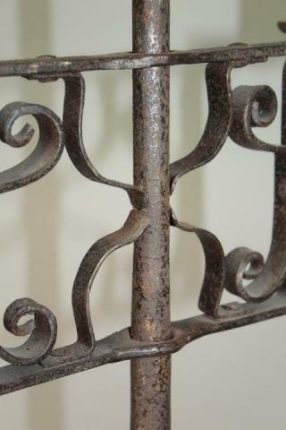 A RARE 18TH C FLOOR STANDING WROUGHT IRON ADJUSTABLE DOUBLE CANDLE HOLDER 10