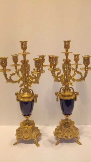 A GILT BRASS AND COBALT PORCELAIN CANDELABRAS CLOCK GARNITURE 11