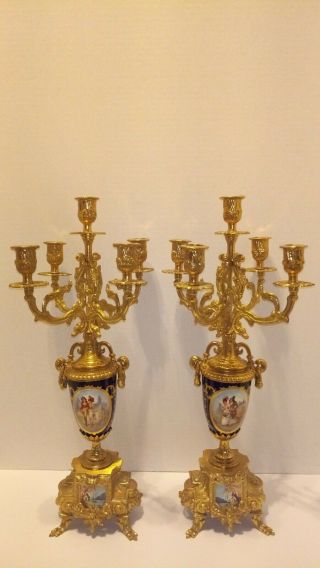 A GILT BRASS AND COBALT PORCELAIN CANDELABRAS CLOCK GARNITURE 2