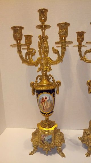 A GILT BRASS AND COBALT PORCELAIN CANDELABRAS CLOCK GARNITURE 3