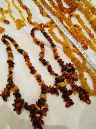 A group of Victoria vintage egg yolk amber pendants/necklace 391grams 8
