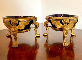 Gold/gilt Footed Winged Lion Open Salt Cellar With Cobalt Glass Inserts.