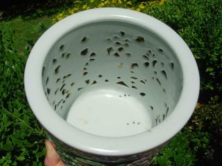 AN OLD CHINESE FAMILLE ROSE RETICULATED BRUSH POT WITH INSCRIPTION 11