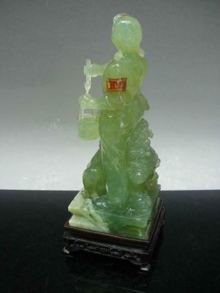 CHINESE GREEN HARDSTONE FIGURE OF A 