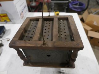 primitive bedside coal heater with tin 9