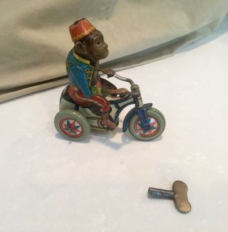 Rare ARNOLD,  US Zone Germany - Wind up Tin Monkey on tricycle 1946 with wind KEY 2