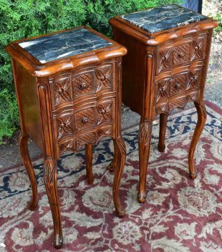 1910s French Antique carved walnut & black marble top small nightstands 2