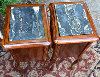 1910s French Antique carved walnut & black marble top small nightstands 3