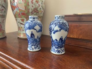 A Fine Quality 19thc Chinese Blue And White Figural Baluster Vases.