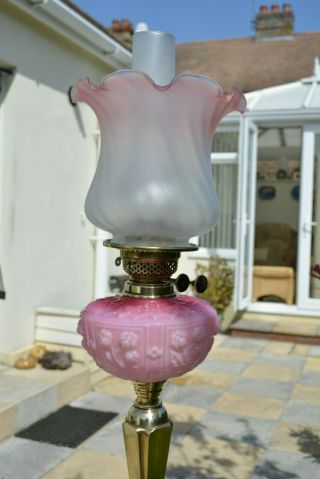 Victorian twin burner oil lamp pink.  Cranberry font and shade solid brass base 2