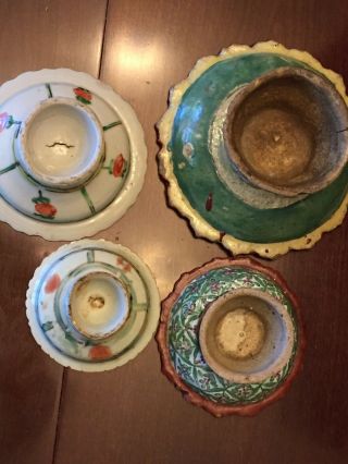 Stack of antique Chinese hand painted multicolored pottery dishes. 3