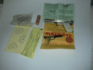 Bulls - Eye Sharpshooter Vintage Rubber Powered Pistol Nickle & Paper Work,