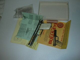 Bulls - Eye Sharpshooter Vintage Rubber Powered Pistol Nickle & Paper work, 2