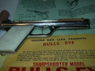 Bulls - Eye Sharpshooter Vintage Rubber Powered Pistol Nickle & Paper work, 3