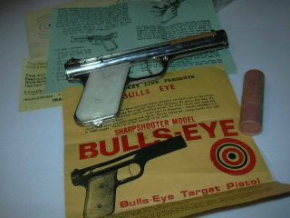 Bulls - Eye Sharpshooter Vintage Rubber Powered Pistol Nickle & Paper work, 5