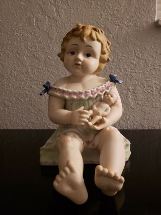 Antique German Bisque Porcelain Piano Baby Girl Holding A Doll