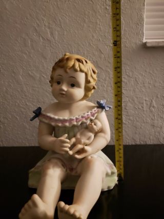 Antique German Bisque Porcelain Piano Baby Girl Holding a Doll 2