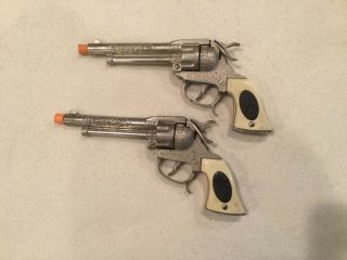 Matched Pair Leslie Henry Maverick Cap Guns