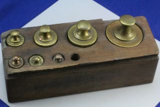 Antique Balance Scale Weights In Wood Block.