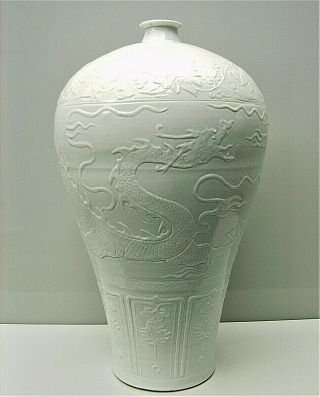 Chinese Large White Glazed Carved Porcelain Dragon Meiping Qing