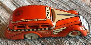 Marx Tricky Taxi Orange 7108 Tin Litho Toy Car,  No Key