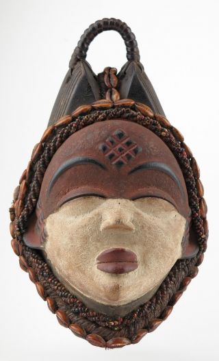 African tribal art.  Punu maiden mask. 4