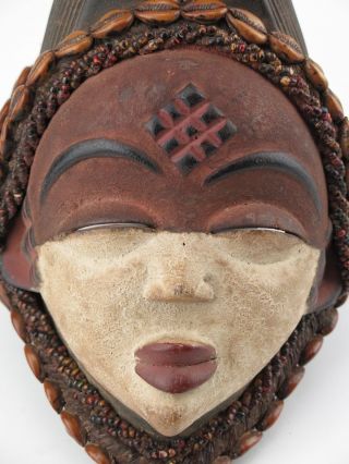 African tribal art.  Punu maiden mask. 5