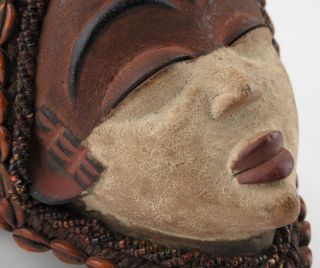 African tribal art.  Punu maiden mask. 6