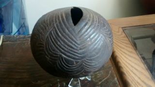 An Abelam coconut shell water vessel from Kuminimbus Village,  mid 20th century, 2