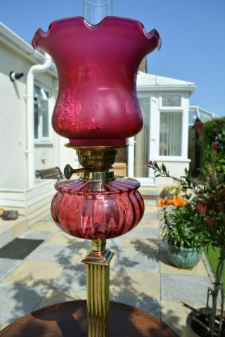 Victorian twin burner oil lamp.  Cranberry font.  and shade 3