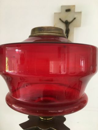 large oil lamp with blood red glass fount,  brass corinthian base and red shade 3