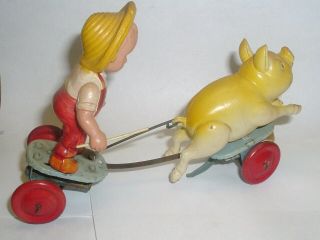 FARMER SWINGING STICK CHASES SQUEALING PIG RUNS TIN & CELLULOID WINDUP TOY JAPAN 3