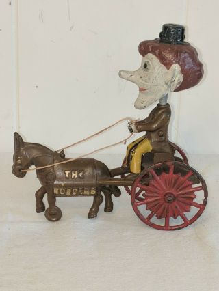 ANTIQUE CAST IRON PULL TOY THE NODDERS MAN 2
