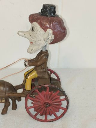ANTIQUE CAST IRON PULL TOY THE NODDERS MAN 5