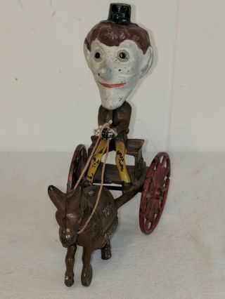 ANTIQUE CAST IRON PULL TOY THE NODDERS MAN 7