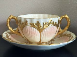 Coalport Antique Pink And Gold Shell Double Handle Tea Cup And Saucer