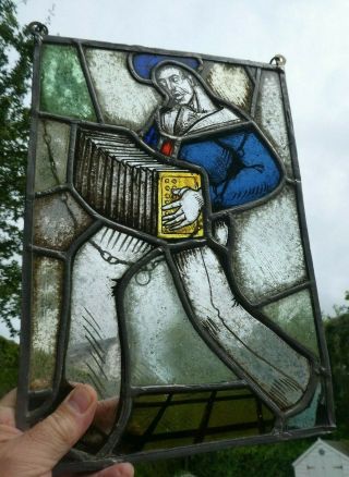 Arts & Crafts Movement Stained Leaded Glass Panel,  Sailor Playing An Accordion