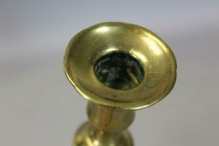 AN EARLY 18TH C ENGLISH QA BRASS CANDLESTICK BALUSTER FORM GREAT PETAL BASE 12