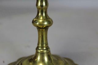 AN EARLY 18TH C ENGLISH QA BRASS CANDLESTICK BALUSTER FORM GREAT PETAL BASE 8