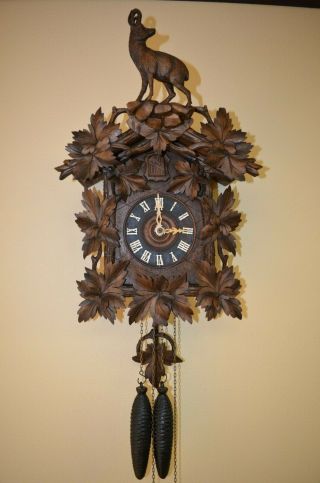ANTIQUE GERMAN BLACK FOREST CUCKOO CLOCK with a IBEX GOAT on top 12