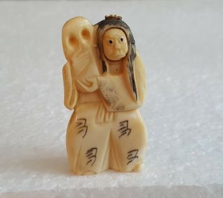 Detailed Hand Carved Japanese Bovine Bone Netsuke Man With Revolving Face