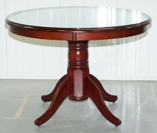 Small Round Mahogany Dining Table Seats Four People With Glass Top Piece